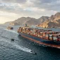 Ilustrasi kapal kargo melewati Selat Hormuz. (AI)